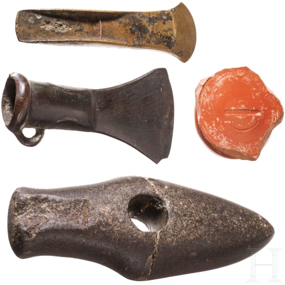 A stone axe, a flanged axe and a socketed axe, Copper Age and Bronze Age, mid-3rd millennium to 8th century B.C., plus a terra sigillata base with stamp