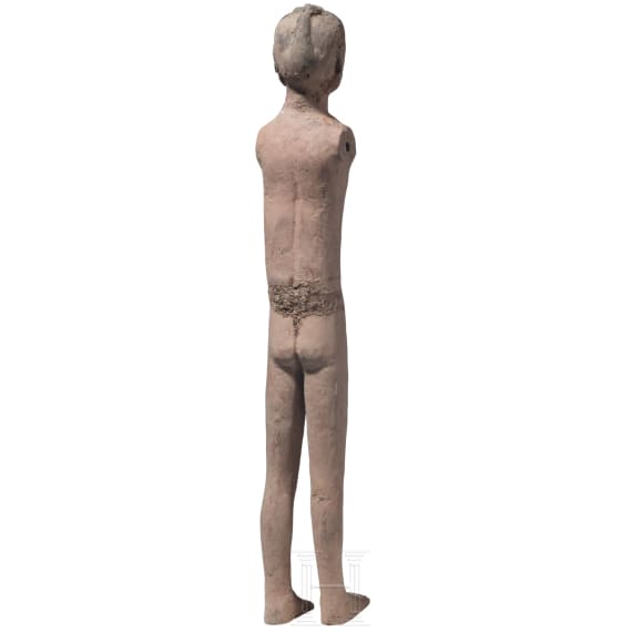 A Chinese painted clay figure of a standing nude man, Han Dynasty, circa 150 B.C.