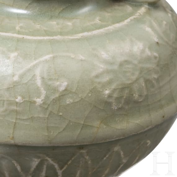 A small Chinese molded Longquan celadon vase, probably Ming Dynasty