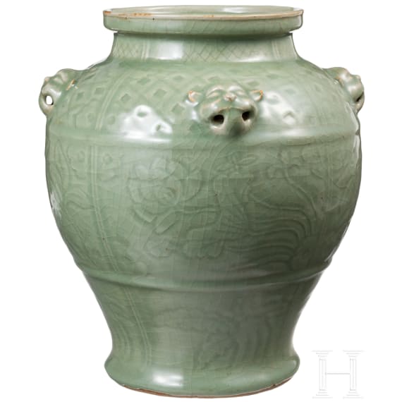 A Chinese molded Longquan celadon jar, probably Yuan Dynasty
