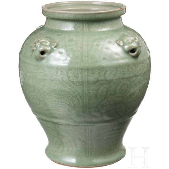 A Chinese molded Longquan celadon jar, probably Yuan Dynasty