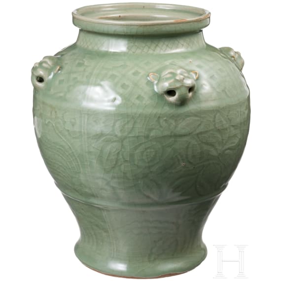A Chinese molded Longquan celadon jar, probably Yuan Dynasty