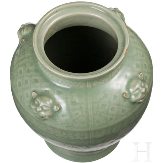 A Chinese molded Longquan celadon jar, probably Yuan Dynasty