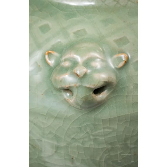 A Chinese molded Longquan celadon jar, probably Yuan Dynasty