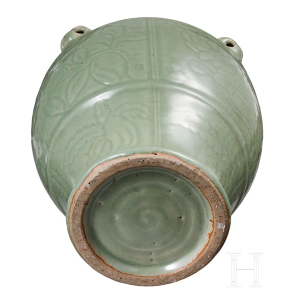 A Chinese molded Longquan celadon jar, probably Yuan Dynasty
