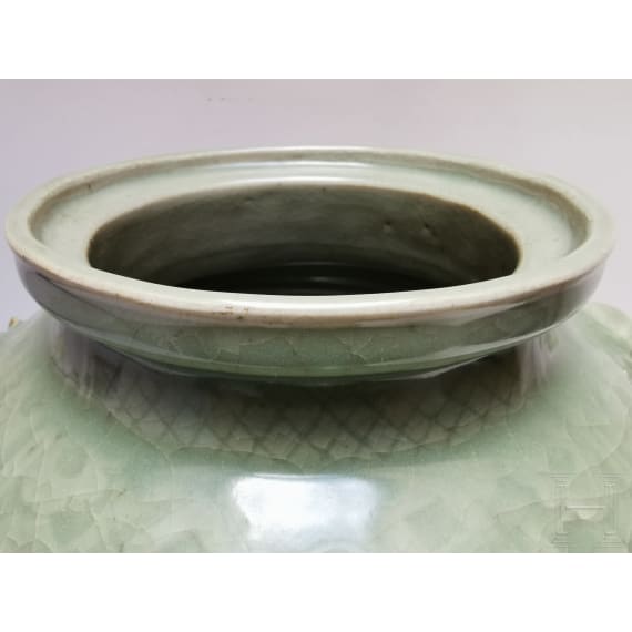 A Chinese molded Longquan celadon jar, probably Yuan Dynasty