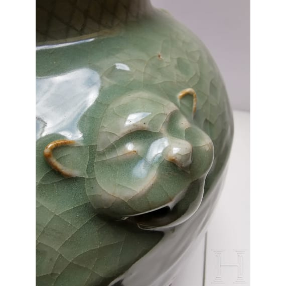 A Chinese molded Longquan celadon jar, probably Yuan Dynasty