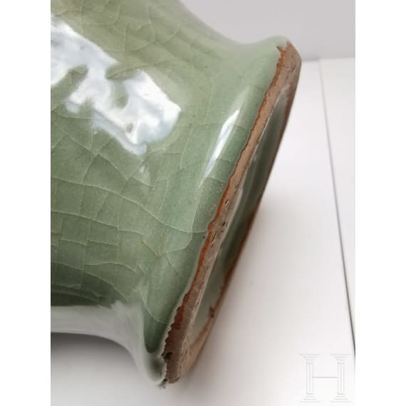 A Chinese molded Longquan celadon jar, probably Yuan Dynasty