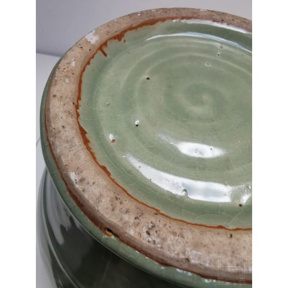 A Chinese molded Longquan celadon jar, probably Yuan Dynasty