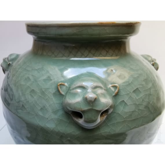 A Chinese molded Longquan celadon jar, probably Yuan Dynasty