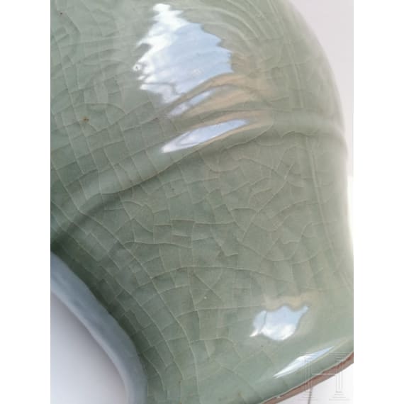 A Chinese molded Longquan celadon jar, probably Yuan Dynasty
