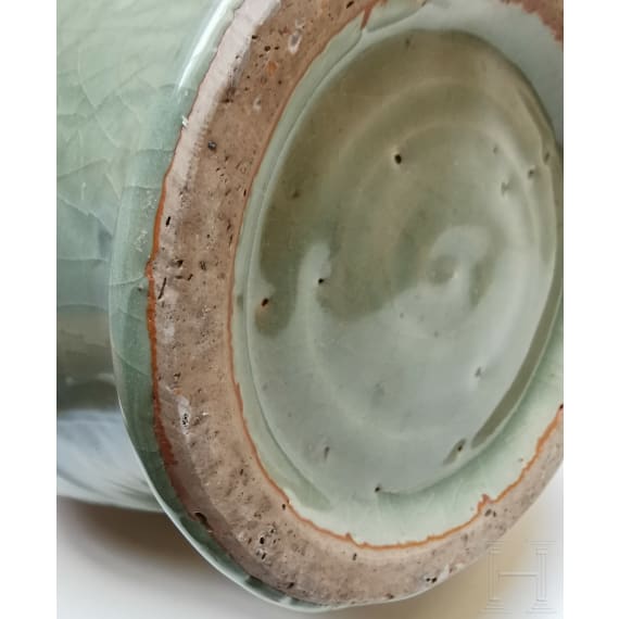A Chinese molded Longquan celadon jar, probably Yuan Dynasty