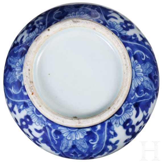 A Chinese blue and white double-gourd porcelain vase with flowers, probably Kangxi period