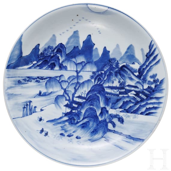 A Chinese blue and white porcelain charger with river and mountain scene, probably 19th/20th century