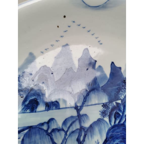 A Chinese blue and white porcelain charger with river and mountain scene, probably 19th/20th century