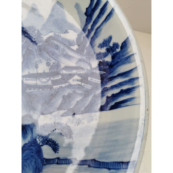 A Chinese blue and white porcelain charger with river and mountain scene, probably 19th/20th century