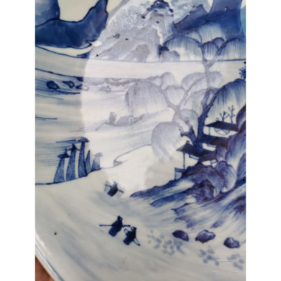 A Chinese blue and white porcelain charger with river and mountain scene, probably 19th/20th century