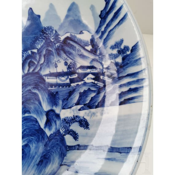 A Chinese blue and white porcelain charger with river and mountain scene, probably 19th/20th century
