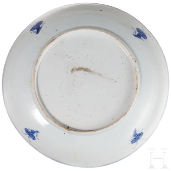 Two Chinese plates and a four-piece storage vessel