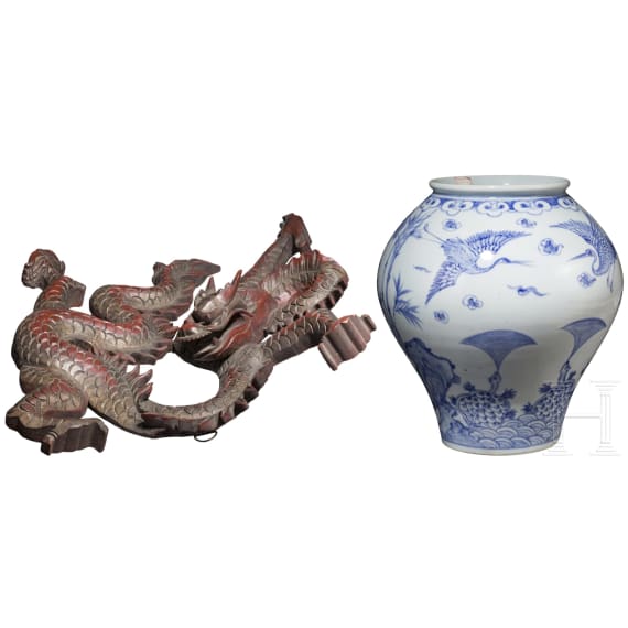 A Korean porcelain vase and a Chinese wooden dragon, 20th century