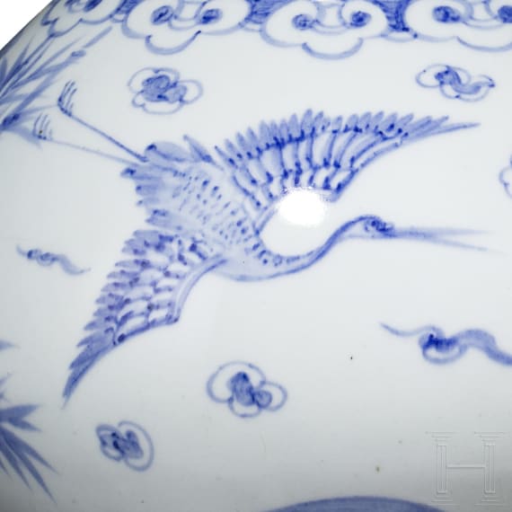 A Korean porcelain vase and a Chinese wooden dragon, 20th century