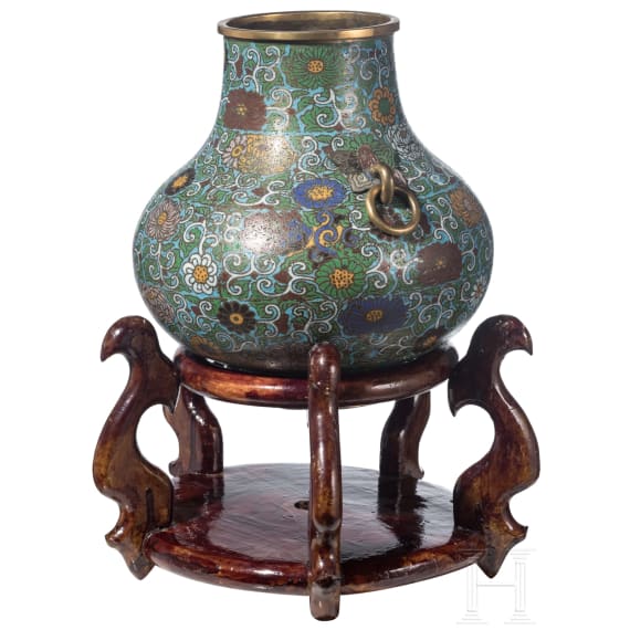 A large Chinese lotus patterned cloisonn&eacute; jar with wooden stand, 20th century