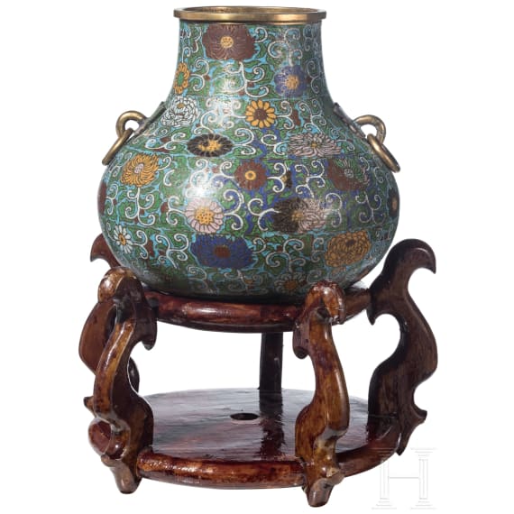 A large Chinese lotus patterned cloisonn&eacute; jar with wooden stand, 20th century