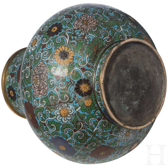 A large Chinese lotus patterned cloisonn&eacute; jar with wooden stand, 20th century