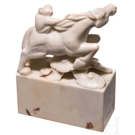 A Japanese marble Netuske carving of a monkey on a horse, probably 1900