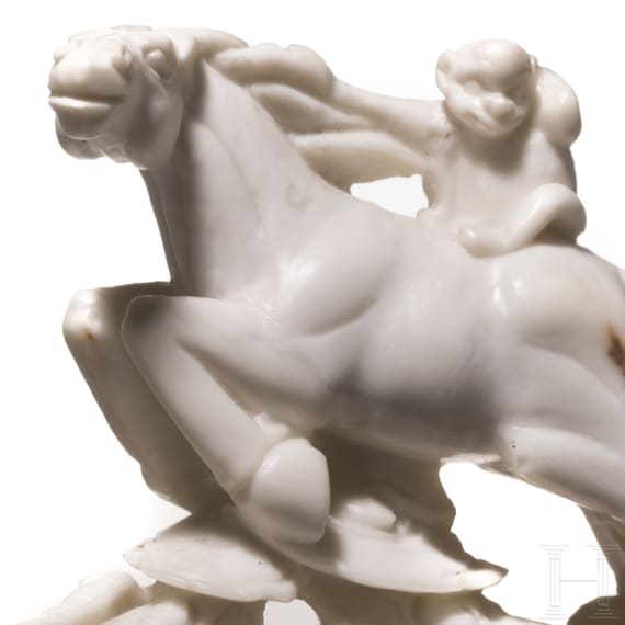 A Japanese marble Netuske carving of a monkey on a horse, probably 1900