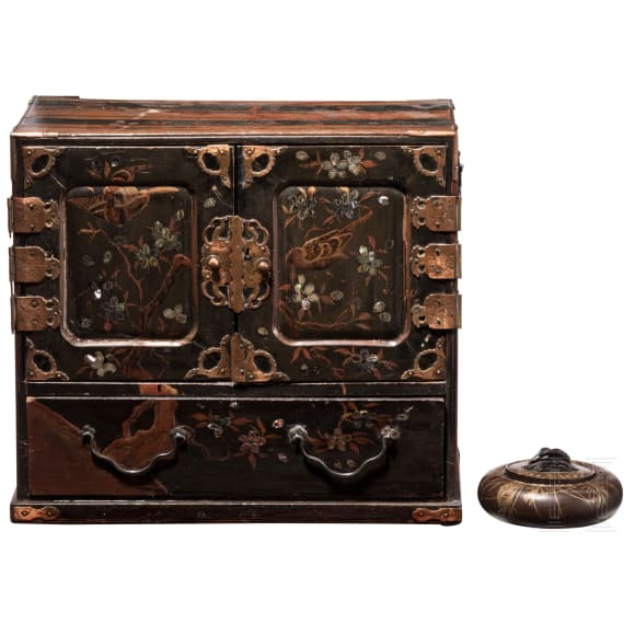A Japanese cabinet with lacquer painting and a round jar, circa 1900