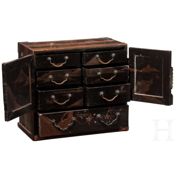A Japanese cabinet with lacquer painting and a round jar, circa 1900