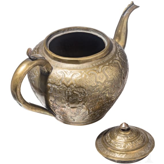 An embossed Persian copper tea pot (jug), Qajar period, circa 1800