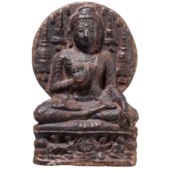 An Indian terracotta figure of a seated Buddha, probably 18th century