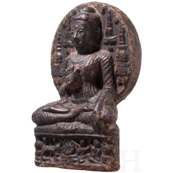 An Indian terracotta figure of a seated Buddha, probably 18th century