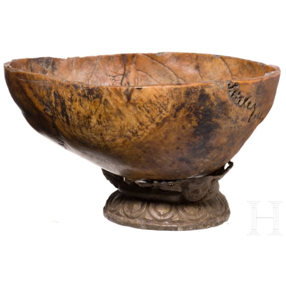 A Tibetan kapala skull bowl on metal stand, 19th century
