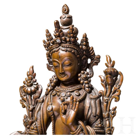 A Nepalese crystal-set bronze figurine of the Green Tara, circa 1900