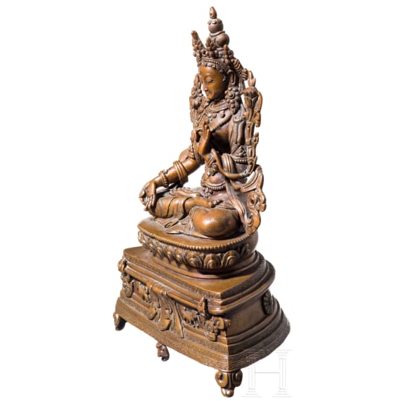 A Nepalese crystal-set bronze figurine of the Green Tara, circa 1900