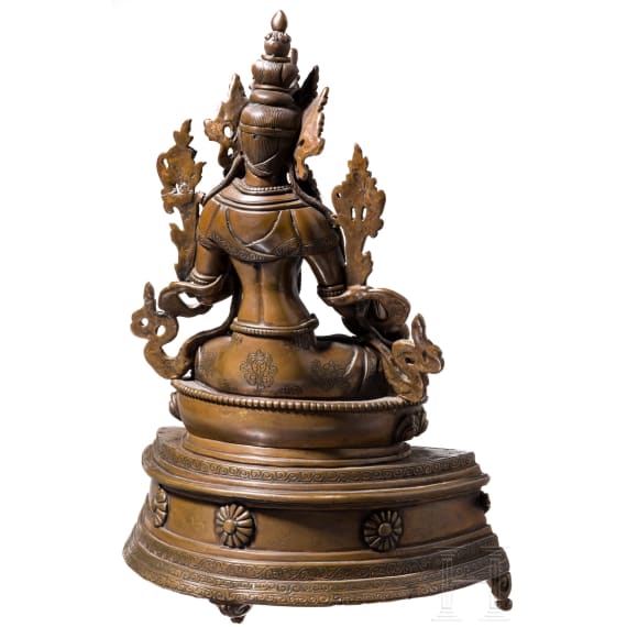 A Nepalese crystal-set bronze figurine of the Green Tara, circa 1900