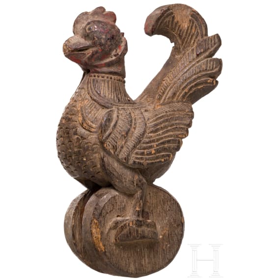 Four mainly Javanese masks and an Indonesian carved wooden chicken, 20th century