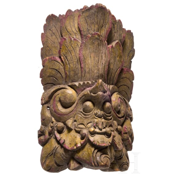 Four mainly Javanese masks and an Indonesian carved wooden chicken, 20th century