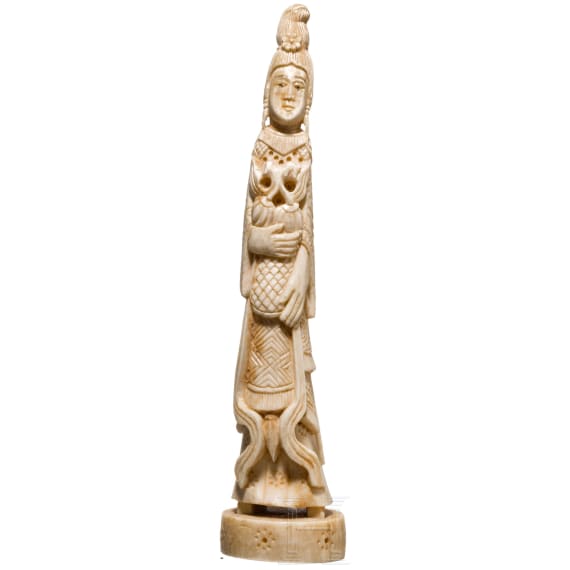 An ivory figure showing a woman with fruits, probably Indian, circa 1900