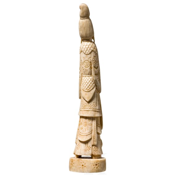An ivory figure showing a woman with fruits, probably Indian, circa 1900