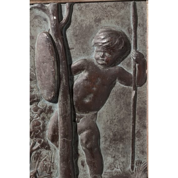 A German stucco relief panel with playing putti, circa 1900