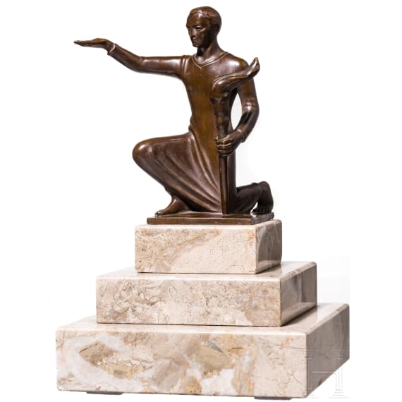 A kneeling torchbearer
