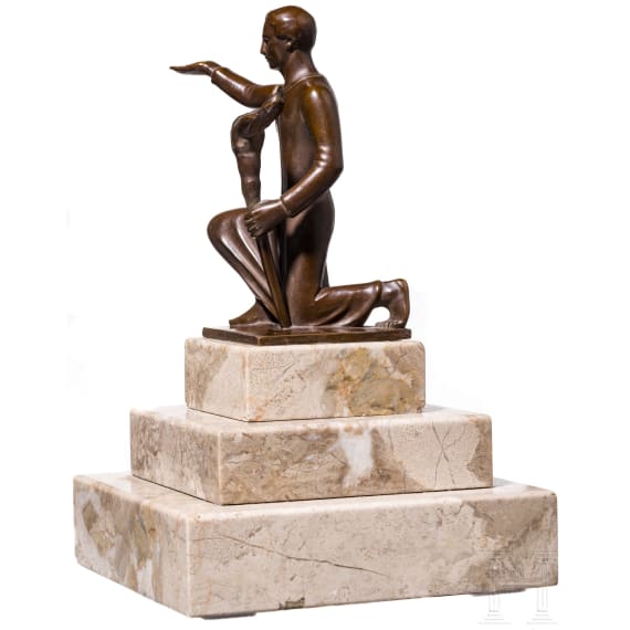 A kneeling torchbearer