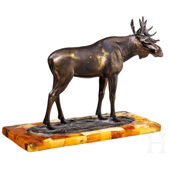 A bronze elk figure on an amber stand, Hendrik Scholter, circa 1930