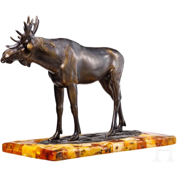 A bronze elk figure on an amber stand, Hendrik Scholter, circa 1930