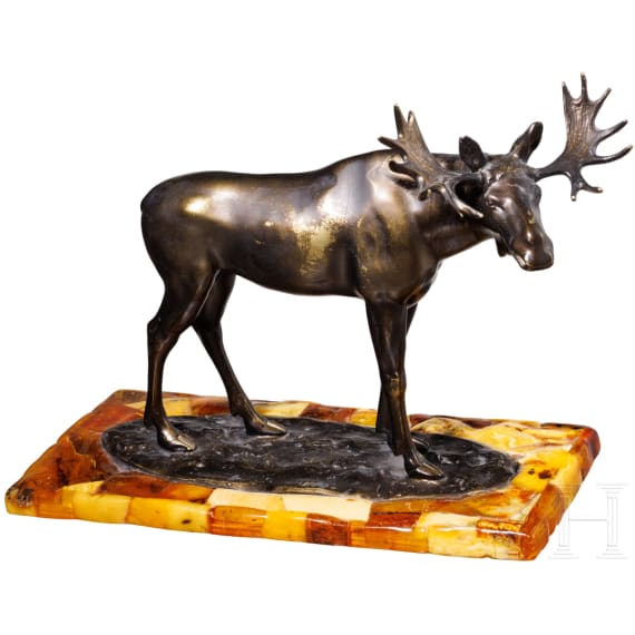 A bronze elk figure on an amber stand, Hendrik Scholter, circa 1930