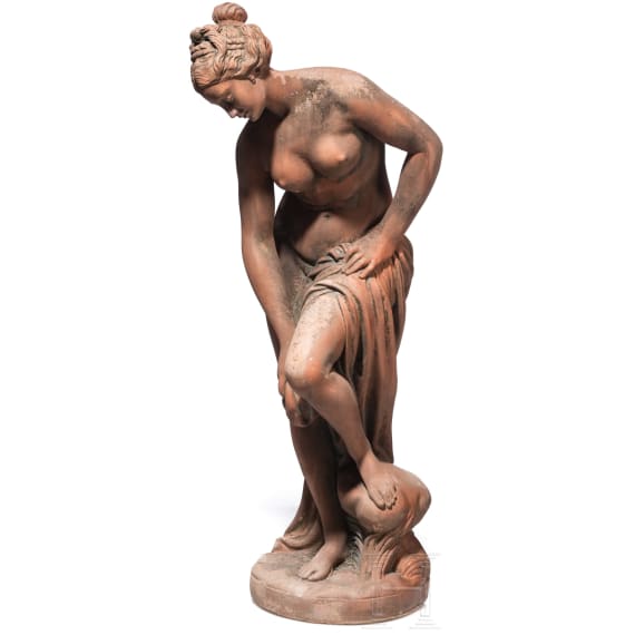 A German cast stone garden statue of a bathing nymph, 20th century